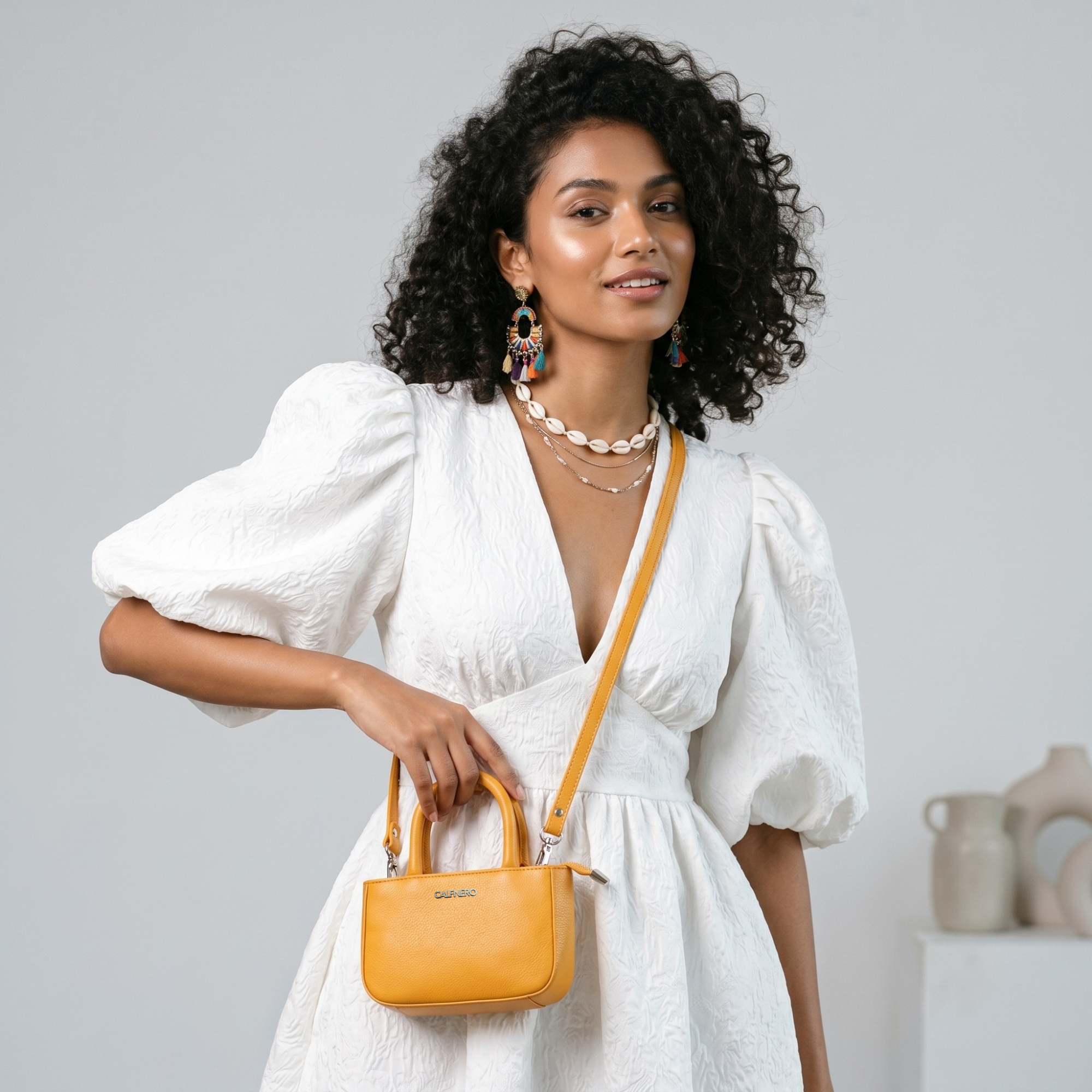 The Mini Muse Sling Bag